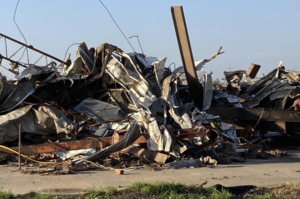 Debris covers a damaged structure in Rolling Fork, Miss,. on Saturday, March 25, 2023. (AP Photo/Rogelio Solis)