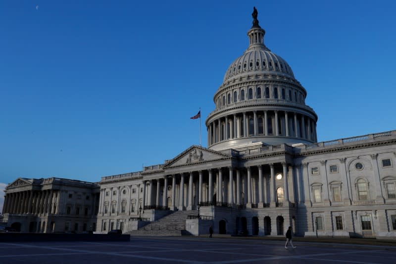 People walk by the U.S. Capitol building in Washington, U.S., February 8, 2018. REUTERS/ Leah Millis