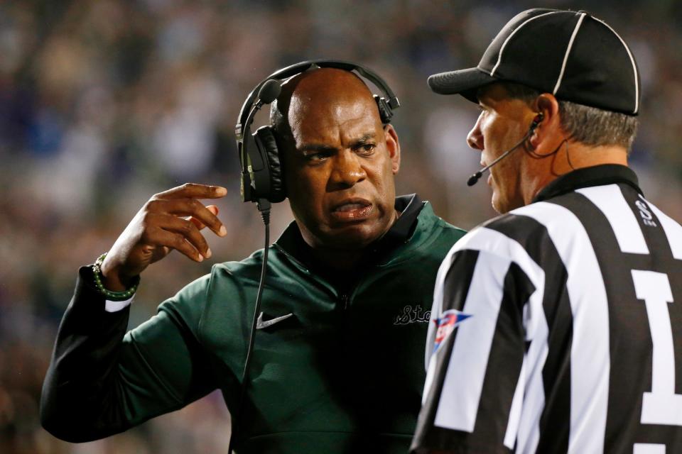 Michigan State coach Mel Tucker talks with an official during the first quarter on Friday, Sept. 3, 2021, in Evanston, Illinois.