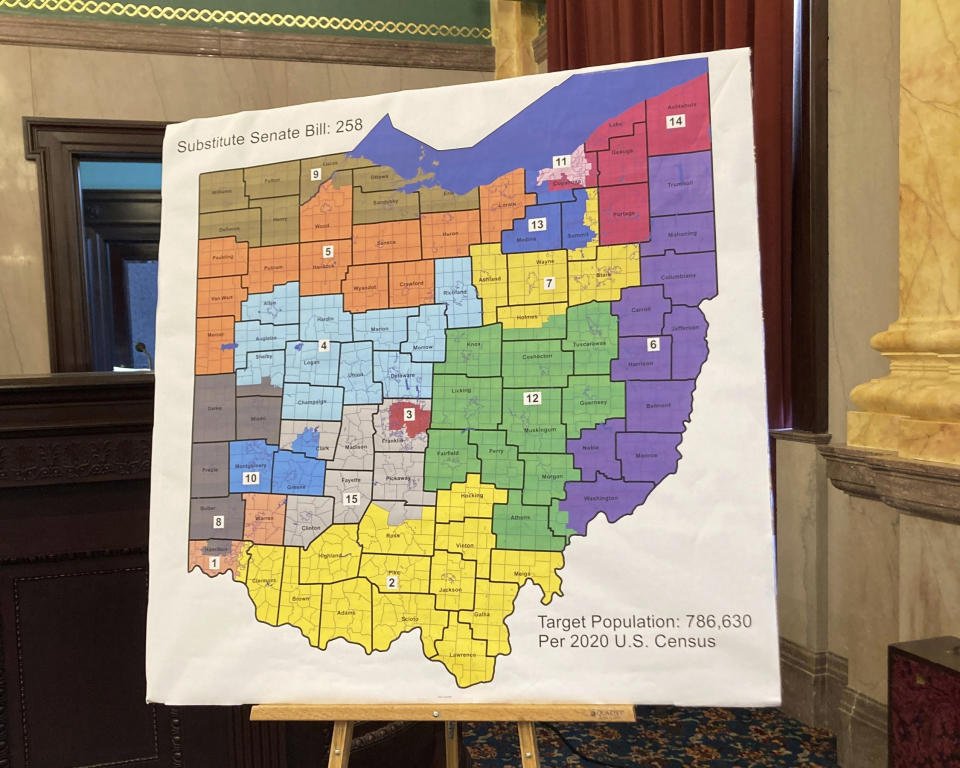 FILE - A map of Ohio congressional districts is displayed during a committee hearing at the Ohio Statehouse in Columbus, Ohio, on Nov. 16, 2021. The election contests of 2022 may have been held and decided, but Ohio’s political maps remain far from settled. What was supposed to be a once-per-decade process for redrawing the state’s U.S. House and Statehouse districts to reflect updated 2020 population figures now promises to extend into 2023, and probably longer. (AP Photo/Julie Carr Smyth, File)