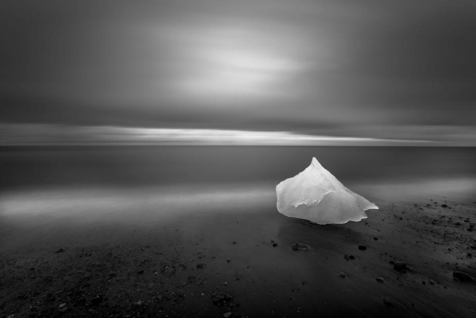 <b>Honorable Mention: East of Iceland</b> <br> Glacial ice washes ashore after calving off the Breiamerkurjˆkull glacier on Iceland's eastern coast. During the waning light of summer this image was created over the course of a 4 minute exposure while the photographer backlit the grounded glacial ice with a headlamp for 2 of those 4 minutes. <a href="http://ngm.nationalgeographic.com/ngm/photo-contest/" rel="nofollow noopener" target="_blank" data-ylk="slk:(Photo and caption by Eric Guth/National Geographic Photo Contest);elm:context_link;itc:0;sec:content-canvas" class="link ">(Photo and caption by Eric Guth/National Geographic Photo Contest)</a>