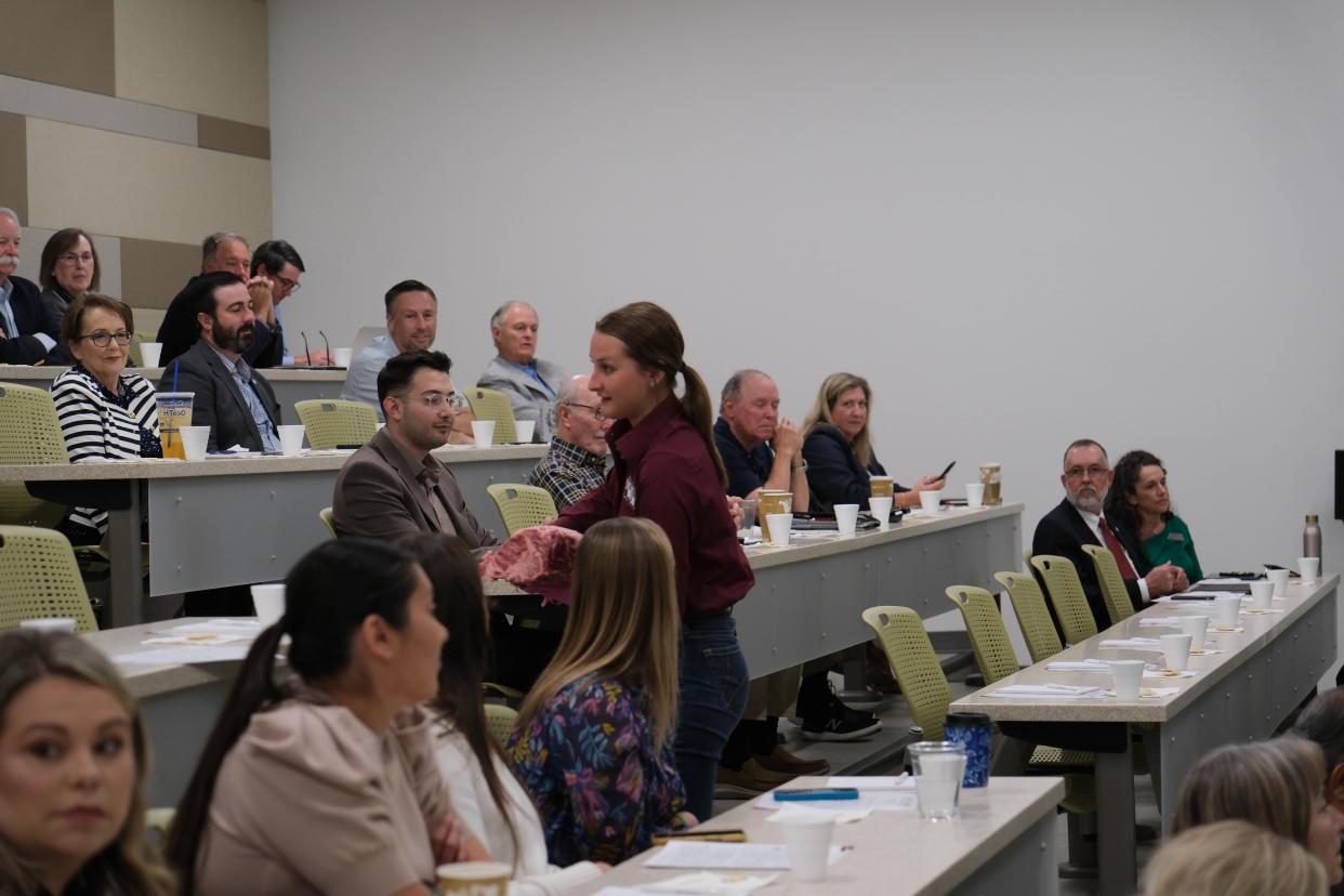 A WT student shows those in attendee a beef portion Tuesday at a One West Campaign Steering Committee Meeting at West Texas A&M.