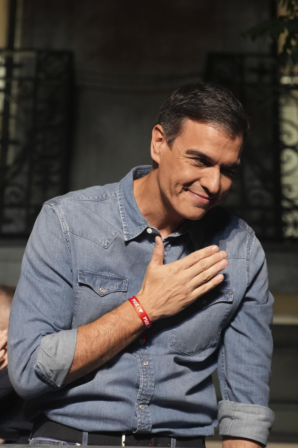 Socialist Workers' Party leader and current Prime Minister Pedro Sanchez greets supporters outside the party's headquarters in Madrid, Spain, Sunday July 23, 2023. Spain's conservative Popular Party is set to narrowly win the country's national election but without the majority needed to topple the coalition government of Socialist Prime Minister Pedro Sánchez. (AP Photo/Emilio Morenatti)