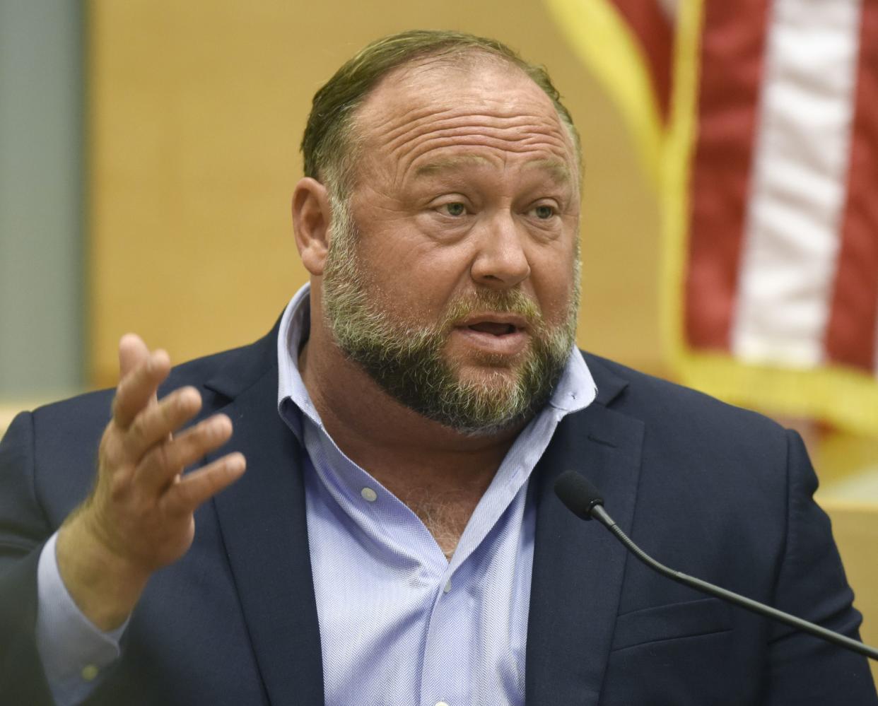 Conspiracy theorist Alex Jones takes the witness stand to testify at the Sandy Hook defamation damages trial at Connecticut Superior Court in Waterbury, Conn. Thursday, Sept. 22, 2022. 