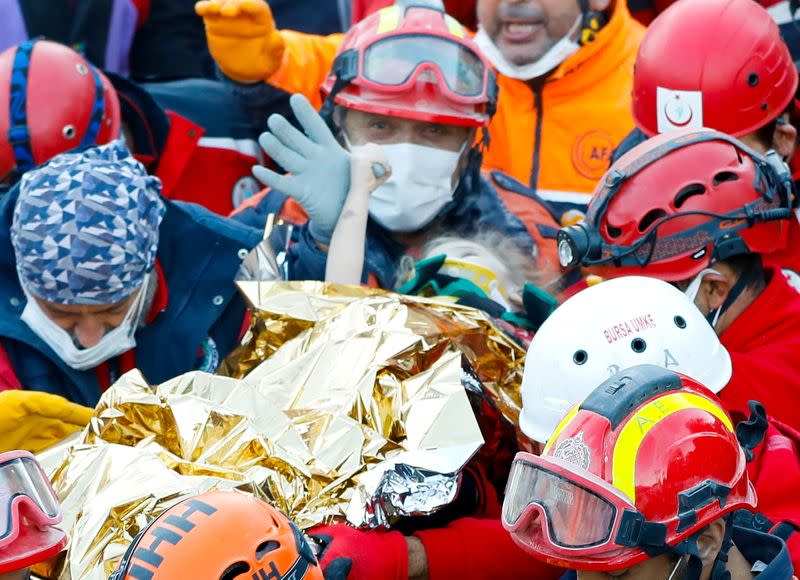 Rescue workers search for earthquake survivors in Izmir