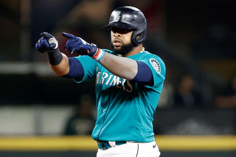 SEATTLE, WASHINGTON - SEPTEMBER 30: Carlos Santana #41 of the Seattle Mariners celebrates his double during the fourth inning against the Oakland Athletics at T-Mobile Park on September 30, 2022 in Seattle, Washington. (Photo by Steph Chambers/Getty Images)