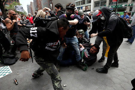 Demonstrators clash with people opposing their rally during a May Day protest in Union Square in New York City, U.S. May 1, 2017. REUTERS/Mike Segar