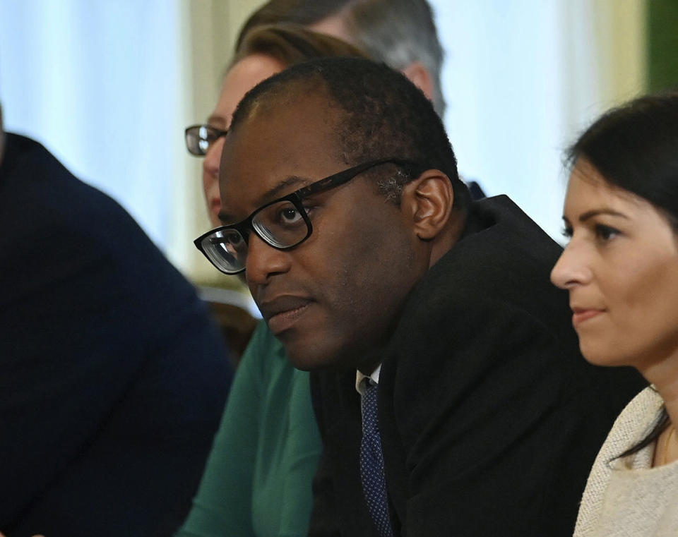 FILE - In this Friday, Sept. 17, 2021 file photo, Britain's Business Secretary Kwasi Kwarteng, centre, participates in the first Cabinet meeting since the reshuffle, at 10 Downing Street, in London, Friday, Sept. 17, 2021. Britain's business secretary will hold emergency talks with industry leaders and consumer groups as the government looks for ways to support energy companies threatened by soaring natural gas prices. Kwasi Kwarteng says that Britain’s energy regulator would ensure gas and electricity keeps flowing to customers if their energy supplier fails. (Ben Stansall/Pool Photo via AP, File)