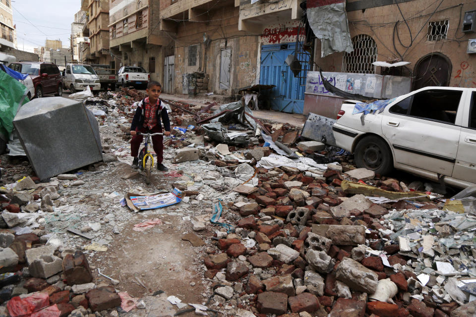 A Yemeni boy rides a bike on rubble of houses destroyed in a recent airstrike carried out by warplanes of the Saudi-led coalition, on May 23, 2019, in Sanaa, Yemen. (Photo: Mohammed Hamoud/Getty Images)