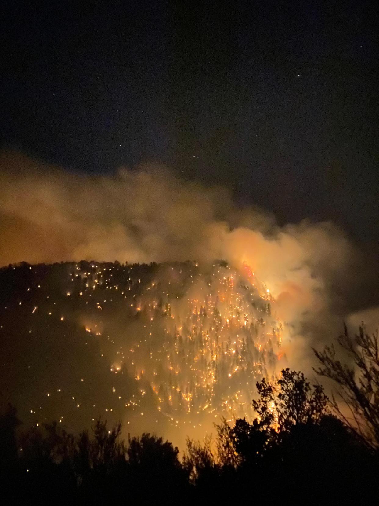 Sparks are shown from night operations on the Black Fire June 8, 2022 in the Gila National Forest.