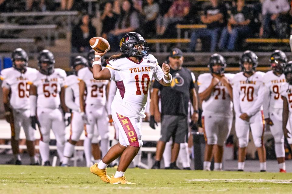 Tulare Union's Jordan Crisp passes against Redwood in non-league high school football on Friday, September 6, 2024.