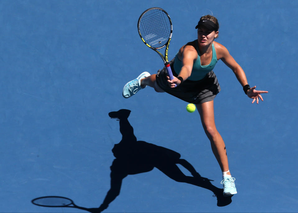 Eugenie Bouchard of Canada makes a forehand return during her quarterfinal against Ana Ivanovic of Serbia at the Australian Open tennis championship in Melbourne, Australia, Tuesday, Jan. 21, 2014.(AP Photo/Eugene Hoshiko)
