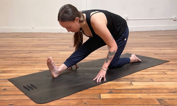 <span class="article__caption">Reaching your hands to the mat can cause strain and misalignment in the rest of your body. </span>(Photo: Ashlee McDougall)