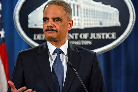 Then U.S. Attorney General Eric Holder addresses a Justice Department news conference in Washington, March 2015. REUTERS/James Lawler Duggan