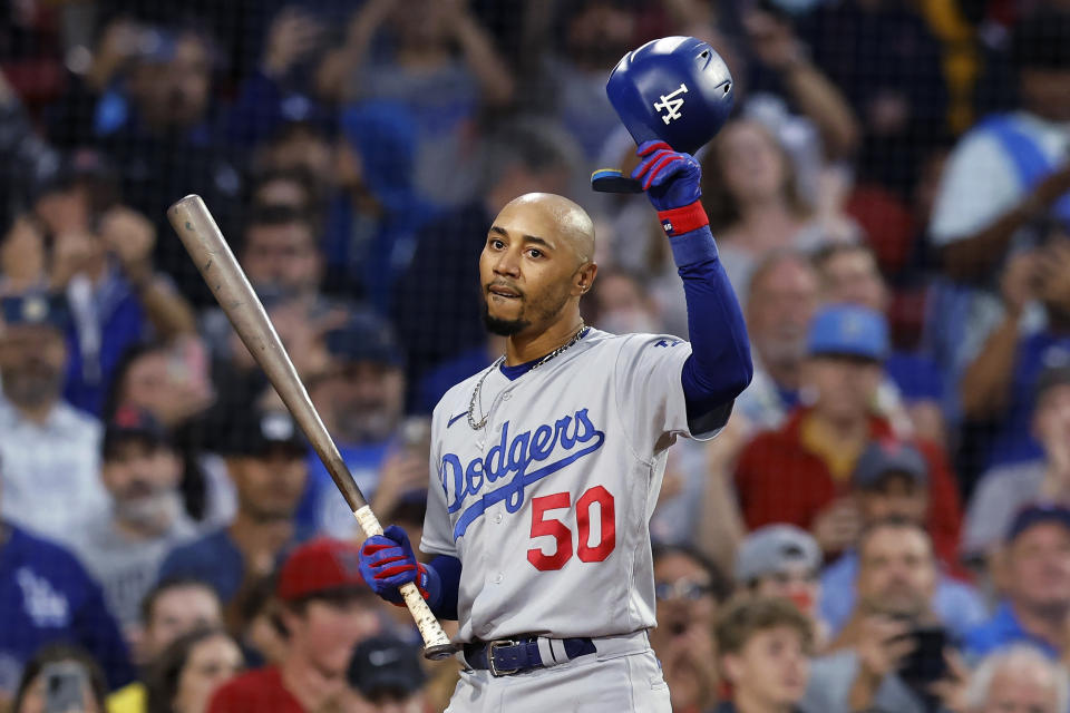 Los Angeles Dodgers' Mookie Betts tips his helmet as he comes up to bat against the Boston Red Sox during the first inning of baseball game Friday, Aug. 25, 2023, in Boston. (AP Photo/Michael Dwyer)