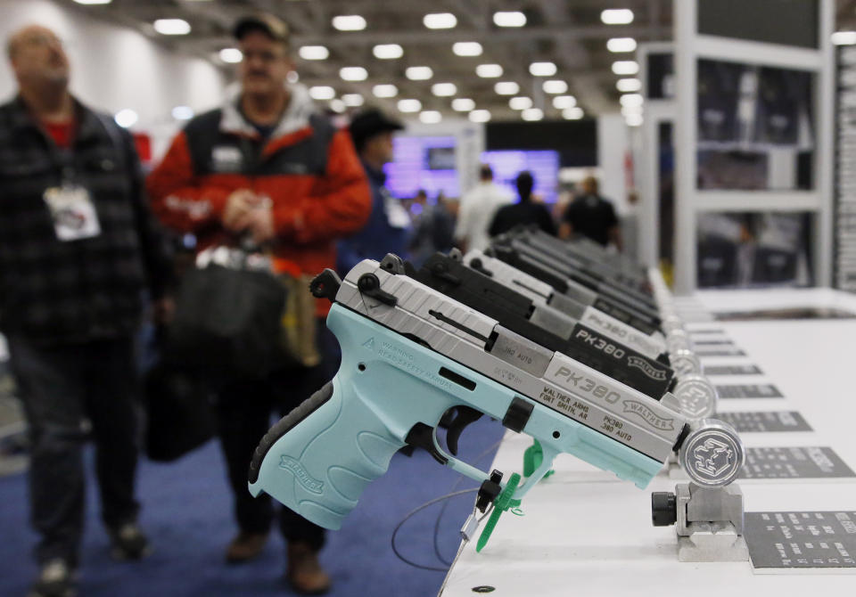 FILE - In this May 4, 2018, file photo, handguns are on display at the NRA convention in Dallas. The National Rifle Association is gathering for its 148th annual meeting beginning Thursday, April 25, 2019, in Indianapolis. (AP Photo/Sue Ogrocki, File)