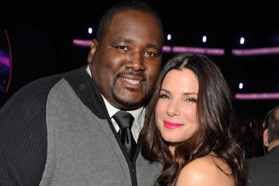 <p>Kevin Mazur/WireImage</p> Quinton Aaron and Sandra Bullock in the audience during 2013 People