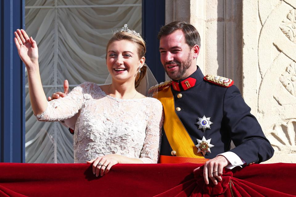 LUXEMBOURG - OCTOBER 20: Princess Stephanie of Luxembourg and Prince Guillaume of Luxembourg wave to the crowds from the balcony of the Grand-Ducal Palace following the wedding ceremony of Prince Guillaume Of Luxembourg and Princess Stephanie of Luxembourg at the Cathedral of our Lady of Luxembourg on October 20, 2012 in Luxembourg, Luxembourg. The 30-year-old hereditary Grand Duke of Luxembourg is the last hereditary Prince in Europe to get married, marrying his 28-year old Belgian Countess bride in a lavish 2-day ceremony. (Photo by Andreas Rentz/Getty Images)