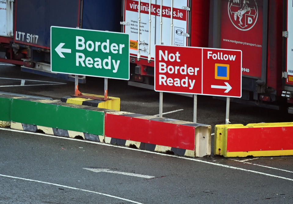 Signage indicates the direction vehicles should follow depending on the relevant paperwork for crossing to Ireland at the check-in area at Holyhead port in Anglesey, north Wales, UK. Photo: Paul Ellis/AFP via Getty Images