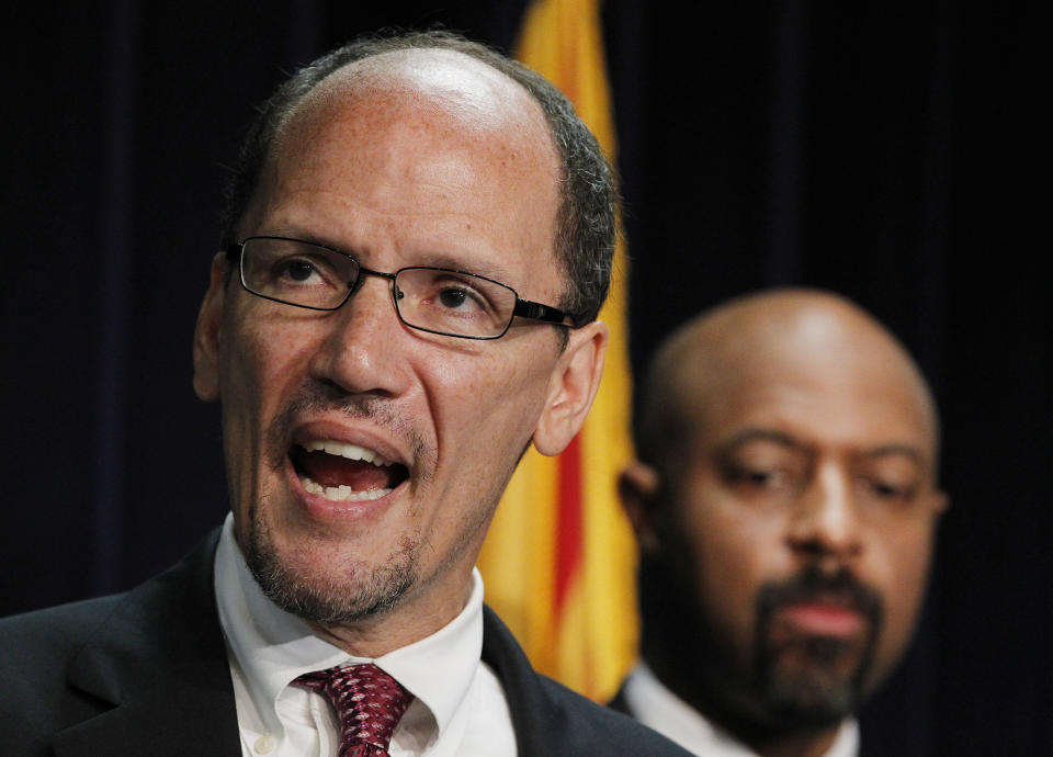 United States Assistant Attorney General Thomas Perez, left, who heads up the civil rights division at the Department of Justice, is joined by Deputy Assistant Attorney General for Civil Rights, Roy Austin, as Perez announces a federal civil lawsuit against Maricopa County Sheriff Joe Arpaio during a news conference Thursday, May 10, 2012, in Phoenix. The move came after months of negotiations failed to yield an agreement to settle allegations that his department racially profiled Latinos in his trademark immigration patrols. (AP Photo/Ross D. Franklin)