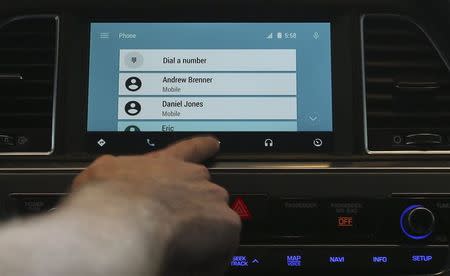 Patrick Brady, Director of Engineering for Android, demonstrates the new Android Auto interface at the Google I/O developers conference in San Francisco in this June 25, 2014 file photo. REUTERS/Elijah Nouvelage/Files