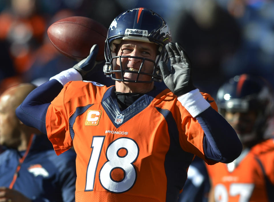 Denver Broncos quarterback Peyton Manning warms up before playing against the San Diego Chargers in an NFL AFC division playoff football game, Sunday, Jan. 12, 2014, in Denver. (AP Photo/Jack Dempsey)