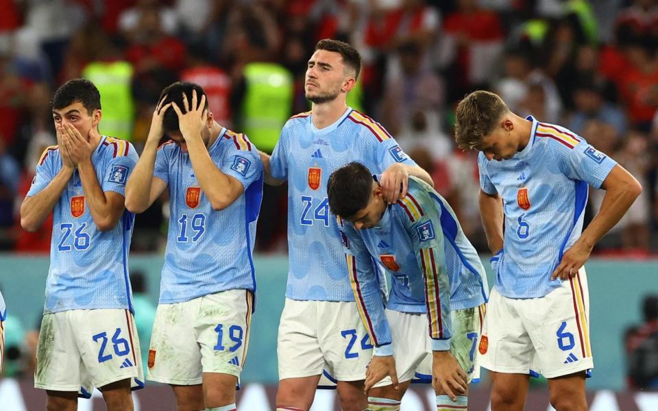 Spain players react after Sergio Busquets misses a penalty during a penalty shootout - REUTERS