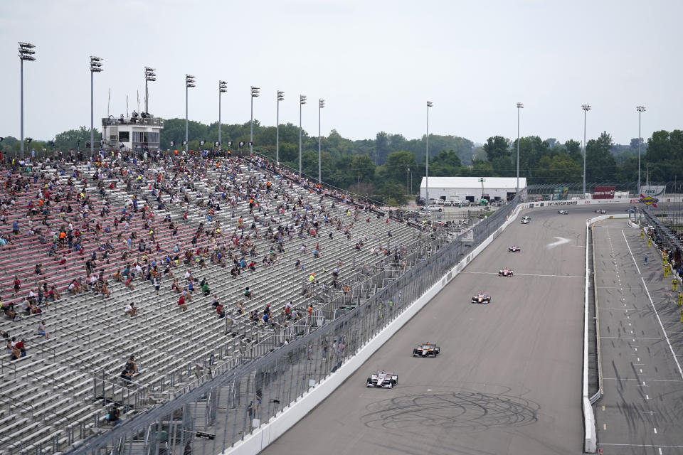 A limited number of fans attend the IndyCar auto race at World Wide Technology Raceway on Saturday, Aug. 29, 2020, in Madison, Ill. (AP Photo/Jeff Roberson)