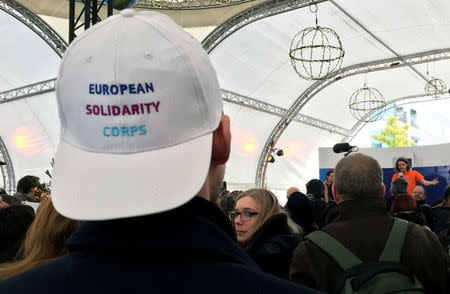 Youths attend the launch of the European Solidarity Corps, a new initiative for young people to travel and help out people in difficulty across the continent, outside the European Commission headquarters in Brussels, Belgium December 7, 2016. REUTERS/Marilyn Haigh