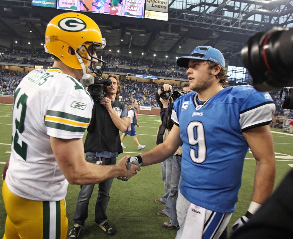 Green Bay Packers Aaron Rodgers greet Detroit Lions quarterback Matthew Stafford during the NFL Thanksgiving day game between the Green Bay Packers-Detroit Lions at Ford Field, Thursday, November 24, 2011.