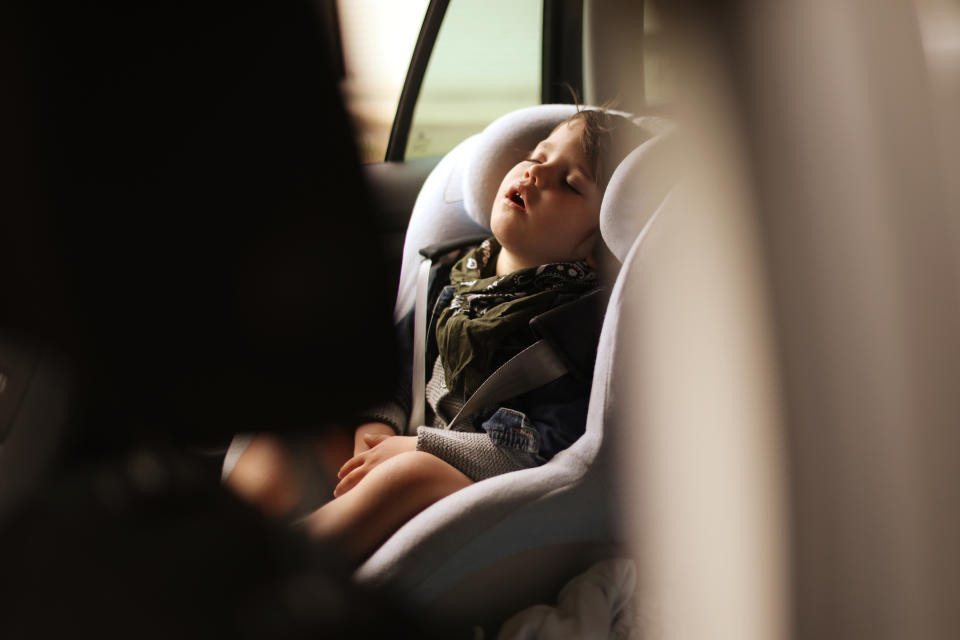 Child asleep in a car seat