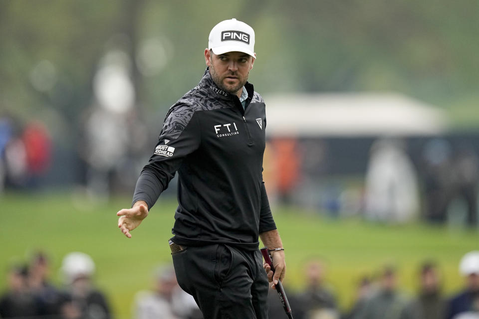 Corey Conners, of Canada, waves after his putt on the 15th hole during the third round of the PGA Championship golf tournament at Oak Hill Country Club on Saturday, May 20, 2023, in Pittsford, N.Y. (AP Photo/Eric Gay)