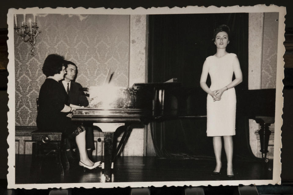 In this family album photograph supplied courtesy of José Miguel Cruz da Costa shows Hannelore Fischer Cruz singing, in Braga, northern Portugal. Born amid the ruins of wartime Vienna, Hannelore Fischer was sent as a small child to Portugal where her flamboyant manner and outstanding soprano voice would later help her build a life far from her place of birth. She died of COVID-19 on March 25, 2020, after four days on a ventilator at Braga's hospital. (Courtesy of José Miguel Cruz da Costa via AP)