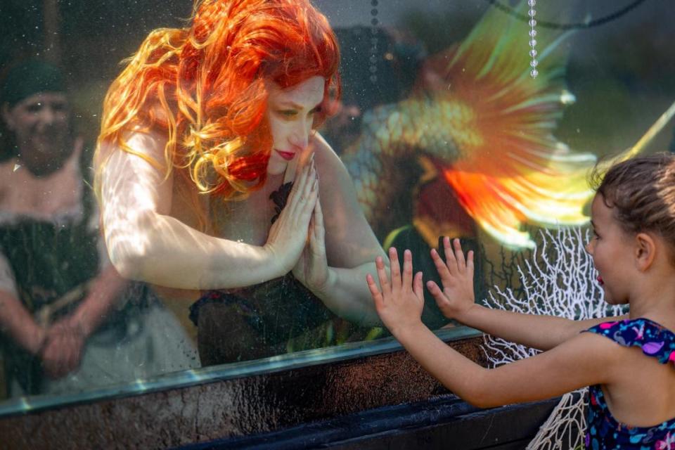 Aurora Rose Watkins performs as Mermaid Nellie in her special portable mermaid tank. Tammy Ljungblad/tljungblad@kcstar.com