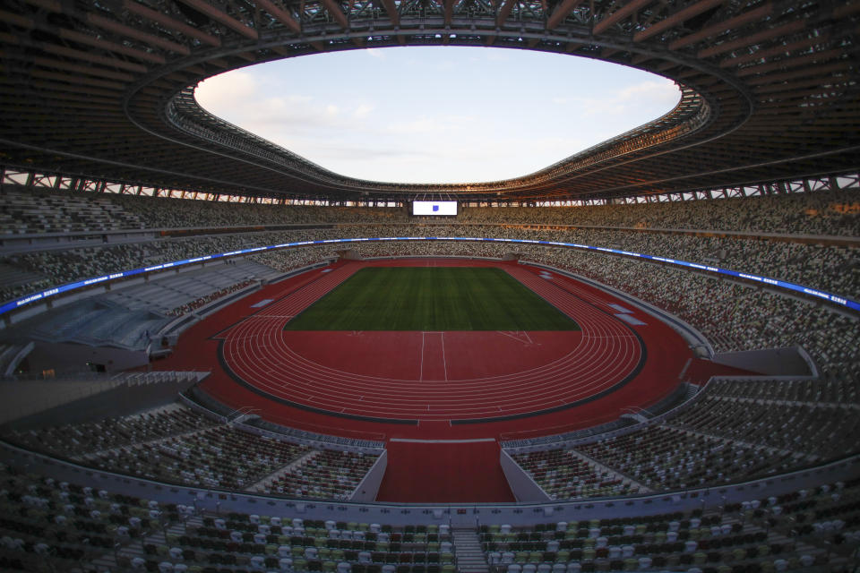 FILE - This Dec. 15, 2019, file photo shows the Japan National Stadium in Tokyo. Tokyo pitched itself as "a safe pair of hands” when it was awarded the Olympics 7 1/2 years ago. Now, nothing is certain as Tokyo's postponed Olympics hit the 100-days-to-go mark on Wednesday, April 14, 2021. (AP Photo/Jae C. Hong, File)