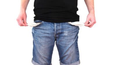 man showing empty pockets