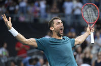 Croatia's Marin Cilic celebrates after defeating Spain's Roberto Bautista Agut in their third round singles match at the Australian Open tennis championship in Melbourne, Australia, Friday, Jan. 24, 2020. (AP Photo/Andy Brownbill)