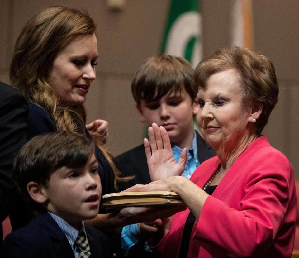 At-Large Commissioner Pat Cotham gets sworn in next to her family at the Charlotte-Mecklenburg Government Center Dec. 5, 2022 in Charlotte, NC.