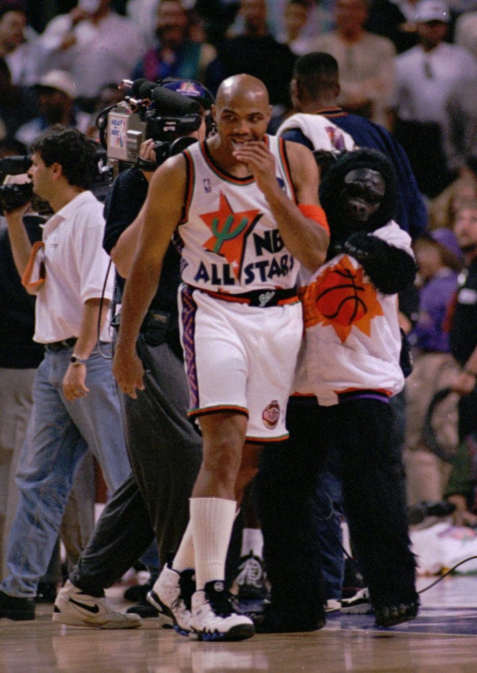 West All Star Charles Barkley of the Phoenix Suns, is seen with the Suns' mascot during an NBA All Star Game time out in Phoenix, Az., February 12, 1995 . (AP Photo/David J. Phillip)