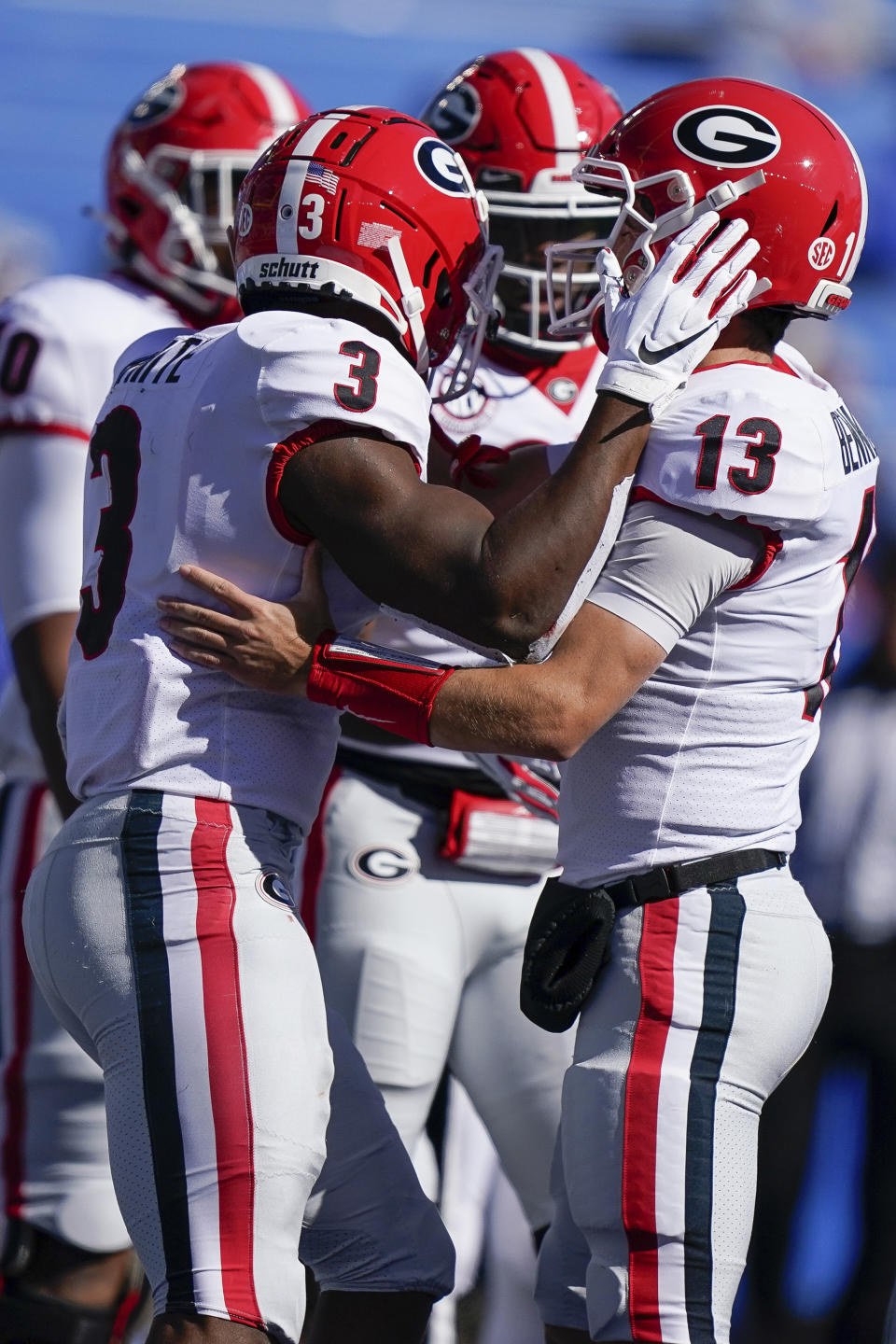 Georgia quarterback Stetson Bennett (13) celebrates with teammates after scoring a touchdown during the first half of an NCAA college football game, Oct. 31, 2020, in Lexington, Ky. (AP Photo/Bryan Woolston)