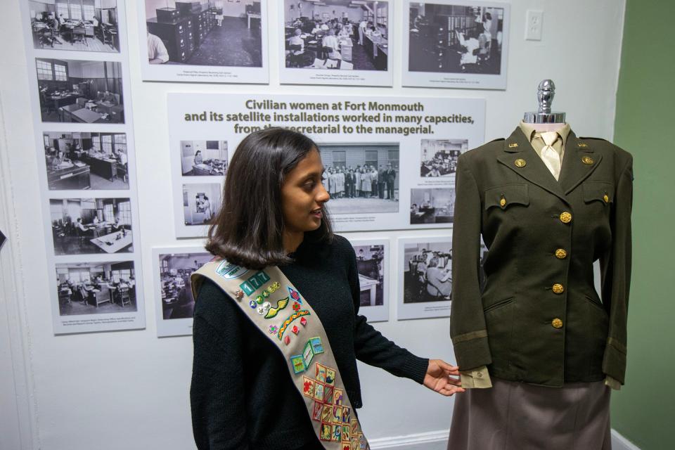 Girls Scouts of the Jersey Shore Cadette Troop 177 member Mahi Shah, 13, of Freehold Township, shows off the uniform of a woman who worked at Fort Monmouth, part of an exhibit he helped create at the InfoAge Science and History Museum in Wall, NJ Monday, November 20, 2023.