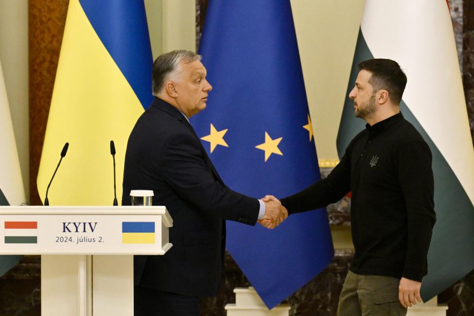 Ukraine's President Volodymyr Zelensky (R) shakes hands with Hungary's Prime Minister Viktor Orban after delivering a press conference in Kyiv (AFP via Getty Images)