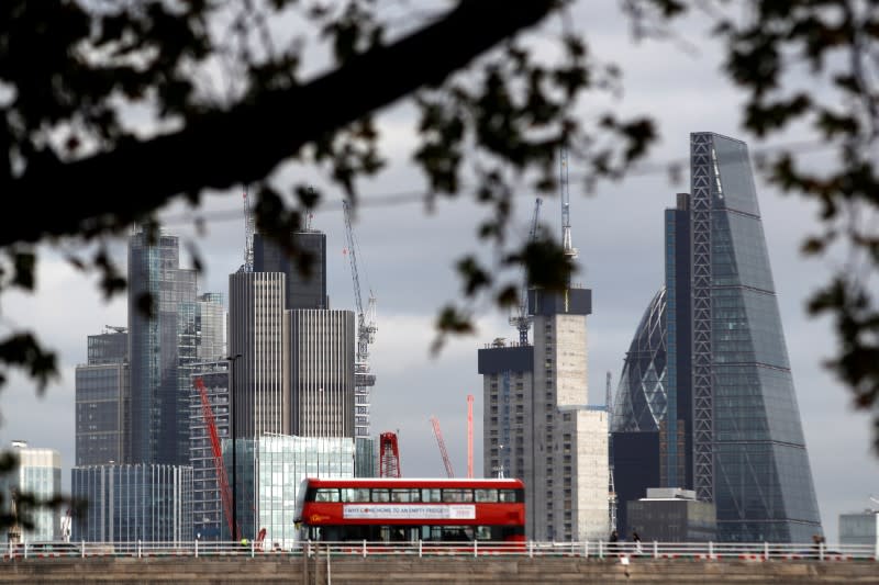 FILE PHOTO: Buildings in the City of London are seen behind Waterloo Bridge in London