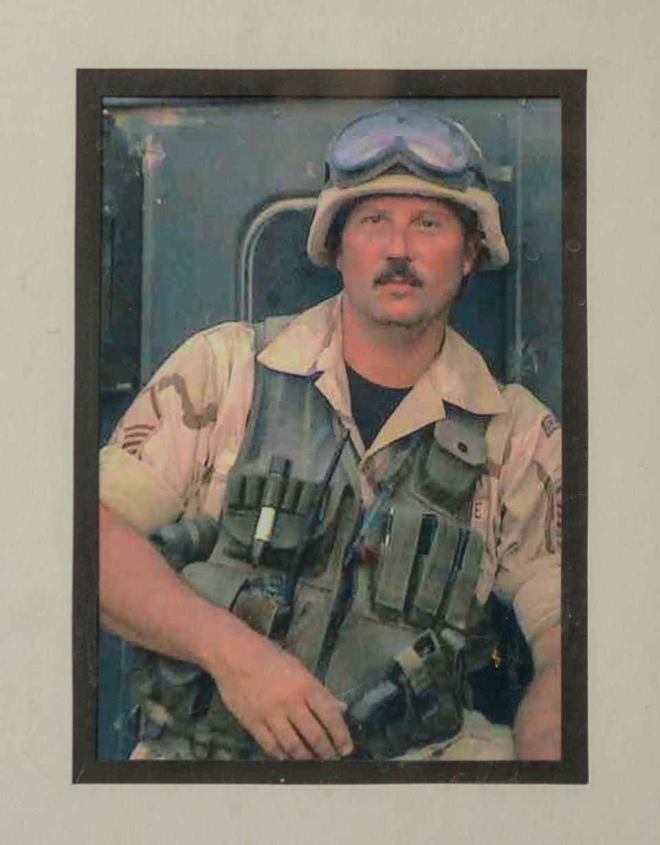 A photo from 2003 show former Fon du Lac Park Police Chief Mike Johnson serving with his Illinois Air National Guard unit in the Iraq War.