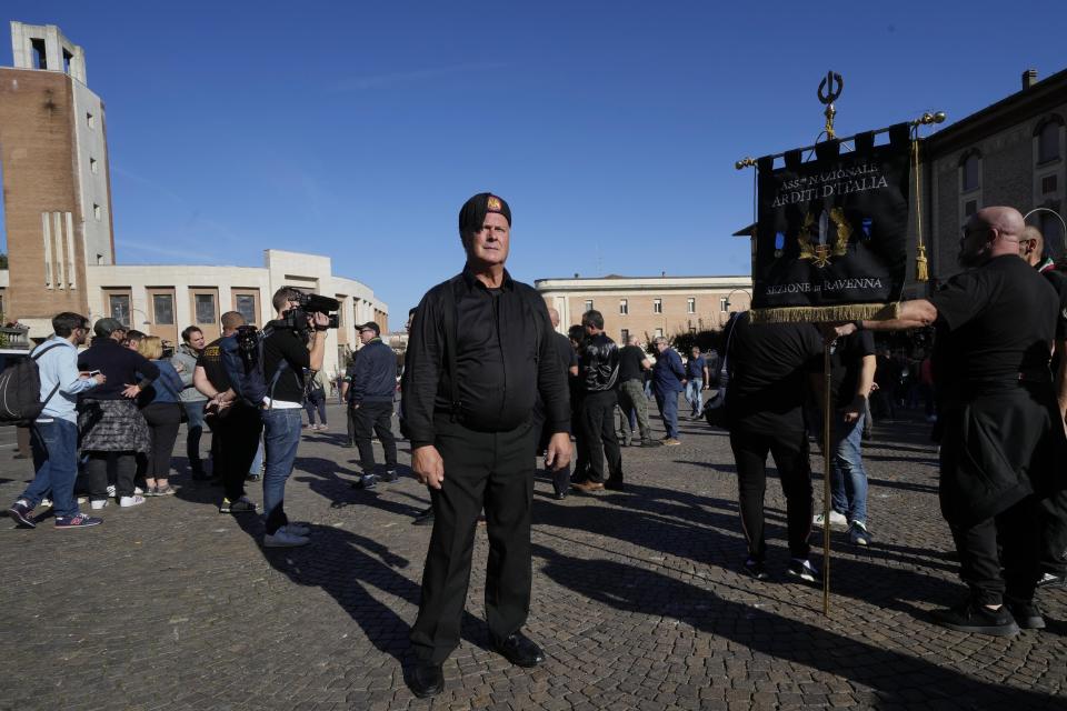 People march in the hometown of former dictator Benito Mussolini to mark the 100th anniversary of the coup d'etat by which he sized power in 1922, in Predappio, Italy, Sunday, Oct. 30, 2022. (AP Photo/Luca Bruno)