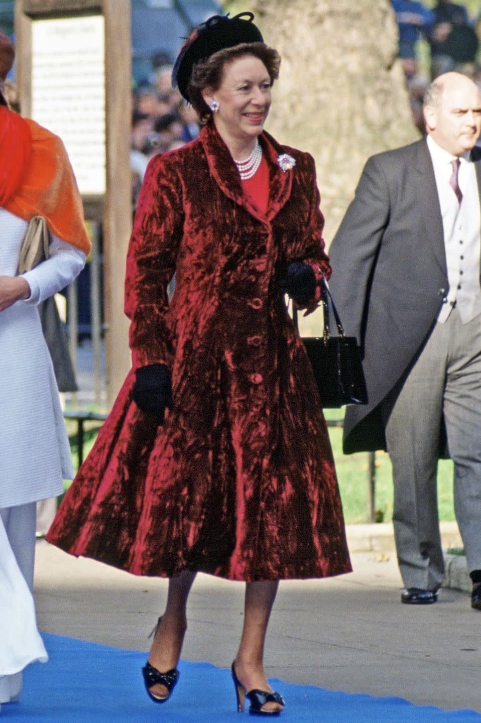 <p>Princess Margaret wore a red and black look to her son, David Linley's, wedding on October 8, 1993.</p>