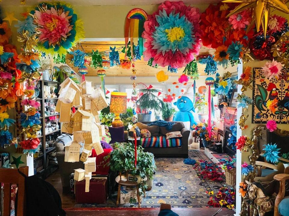 A photo of Tara Kolla's living room in Whitehorse. Kolla, who also owns a vintage shop called The Wishfactory, says, 'Back in the day, we used to be called hoarders. Now we're called maximalists, so it's OK now.' (Tara Kolla - image credit)