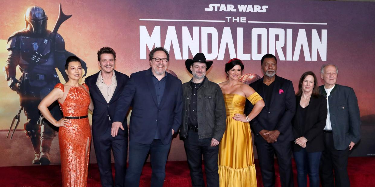 FILE PHOTO: Creator Jon Favreau (3rd L), President of Lucasfilm Kathleen Kennedy (2nd R), executive producer Dave Filoni (C) pose with cast members (L-R) Ming-Na Wen, Pedro Pascal, Gina Carano, Carl Weathers and Werner Herzog at the premiere for the television series 