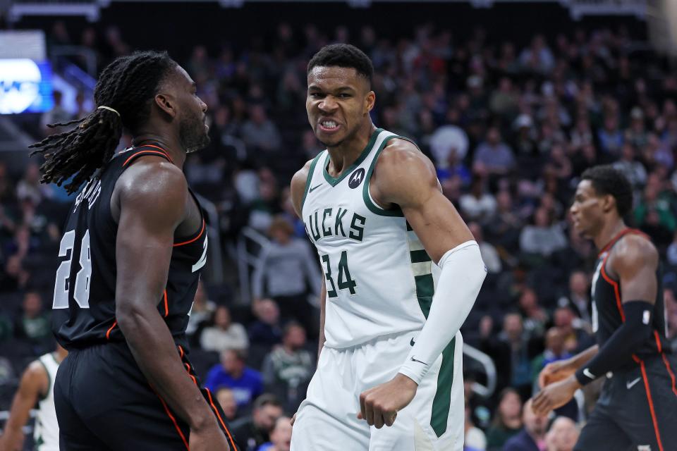 Milwaukee Bucks forward Giannis Antetokounmpo dunks and reacts in front of Detroit Pistons forward Isaiah Stewart during the second half at Fiserv Forum on Nov. 8, 2023 in Milwaukee. Antetokounmpo was given a technical foul for his "taunting" reaction.