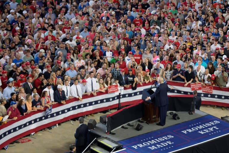 US President Donald Trump (C) told supporters at a 'Make America Great Again' rally in Harrisburg, he was "thrilled" to be far from "the Washington swamp"